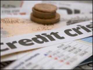 Credit crisis headline and coins