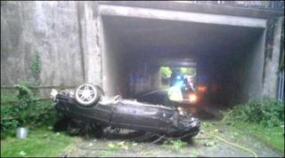 The car on its roof. Pic courtesy of West Midlands Ambulance Service