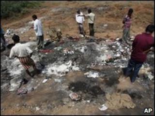 People gather at the site of the accident