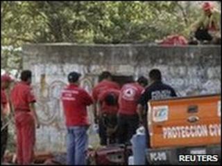 Rescue personnel inspect a ventilation shaft at the mine near Taxco