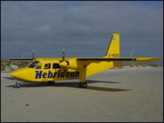 A Hebridean Airways plane on a beach