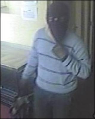 CCTV still of robber
