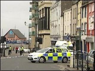 A police car in a sealed off street in Whitehaven