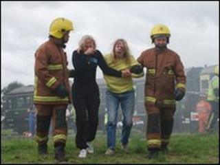 Firefighters and actors playing casualties in Off The Rails in 2008