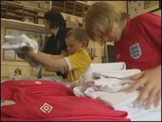 Bernie Roberts and her sons work on the England team's kit