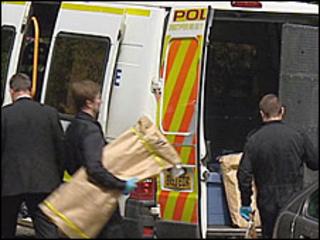 Police officers at Moy Estate