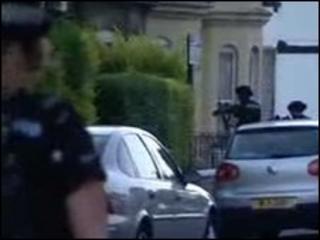 Armed police enter the house