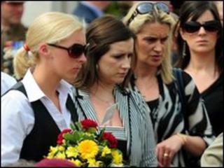 Relatives and friends of fallen service personnel attend the dedication ceremony of 119 names of UK armed forces members