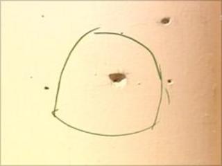 Bullet hole marks at the scene of the shooting