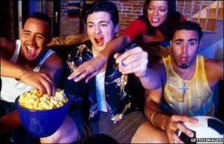 Football fans on the sofa