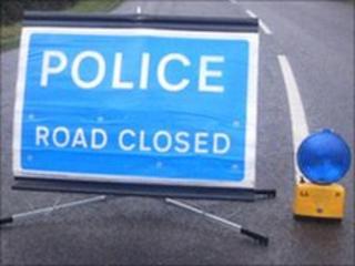 Road closed as car goes over cliff