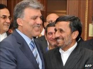 Iranian President Mahmoud Ahmadinejad (R) shakes hands with Turkish President Abdullah Gul in Istanbul on 7 June 2010