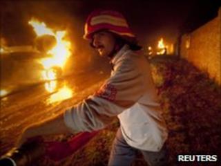 Firefighter tackles blaze after Islamabad attack on Nato convoy