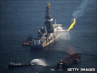 Ship recovering oil from spill site