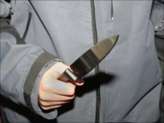 Teenager holding a knife