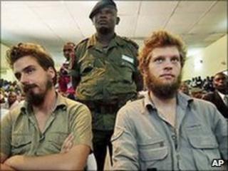 Norwegian citizens Tjostolv Moland, left, and Joshua French, right, listen to a judge reading out their sentence in Kisangani, DR Congo, on 8 September 2009