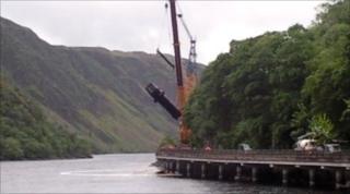 derailed train carriage lifted by crane