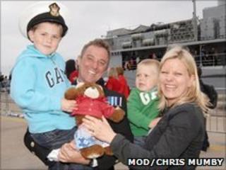 Chief Petty Officer Dennis Nolan, 37, being met by his wife Teresa and sons Will, five, and Zac, two after HMS York returned to Portsmouth on Friday