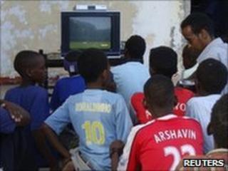 Football fans watch the opening World Cup match in Mogadishu