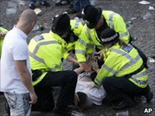 Police arrest a spectator at Castlefield Arena