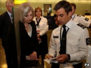 Theresa May meeting security staff at Heathrow airport