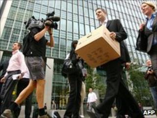 Lehman Bros' London staff leave work after the collapse