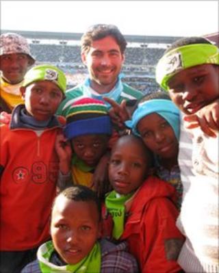 Samuel Mayer with children at World Cup match