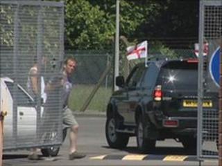 A car is let through the gates