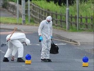 Forensics officers at the scene of the alert