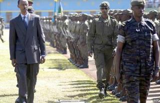 Rwandan President Paul Kagame inspects a military parade in Kigali