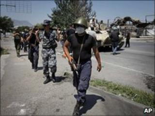 Kyrgyz soldiers conduct a patrol on the Uzbek side of the outskirts of Osh