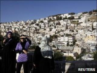 Local women stand above Silwan