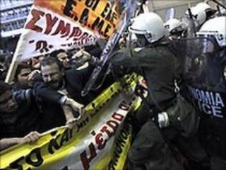 Protestors clash with riot policemen in front of the Greek finance ministry - 29 April