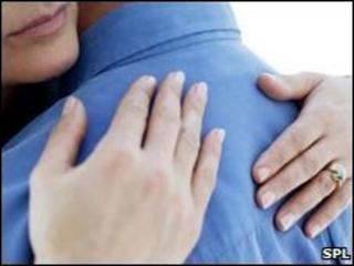 Middle-aged couple embracing