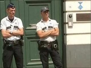 Belgian officials outside the offices of the Archbishop of Mechelen-Brussels