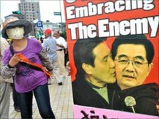 Placard of Taiwan's President Ma Ying-jeou and Chinese President Hu Jintao during a protest in Taipei on 26 June