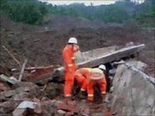 Grab from China state TV showing rescue workers in Dazhai village