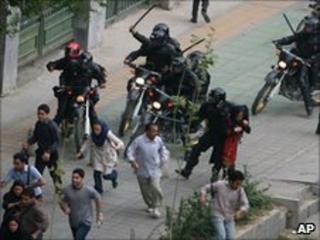 Iranian riot-police clash with protesters during riots in Tehran, June 2009