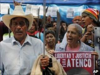 Demonstrators with placards and machetes outside the Mexican supreme court