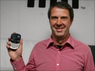 Robbie Bach holding a Microsoft Kin