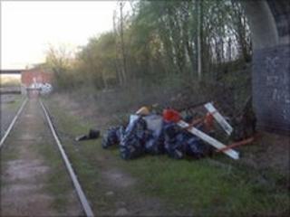 Rubbish beside railway