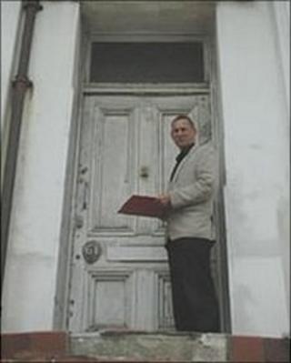 Councillor Jeremy Birch on the steps of a property in Hastings