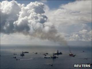 Smoke rises from the BP oil spill site, as natural gas is burned off, while the drilling of two relief wells continue in the Gulf of Mexico