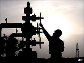Worker checks pipes at PetroChina"s Tarim Oilfield in Xinjiang.