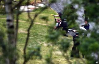 Police training weapons, including a Taser gun, on Raoul Moat during a stand-off