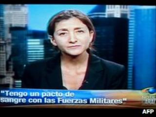 Ingrid Betancourt speaking to Caracol on 11 July with the caption "I have a blood pact with the military"