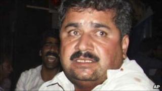 A man helps victims in Zahedan
