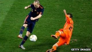 Andres Iniesta of Spain (left) scores the winning goal in the World Cup final, 11 July