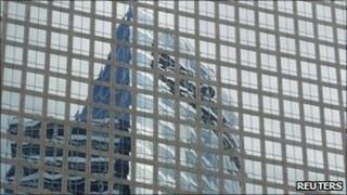 Goldman Sachs' headquarters reflected in a building in New York