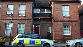 Flats where the body of a woman was found